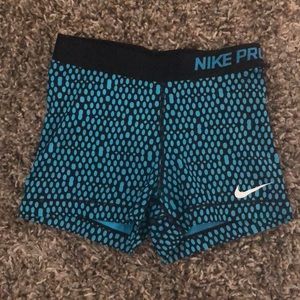 Blue and black NIKE pro shorts